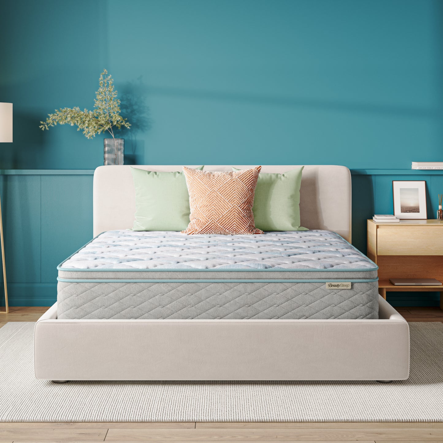 Beautysleep Mattress in a grey bedframe with 3 pillows on top of it within a bedroom setting