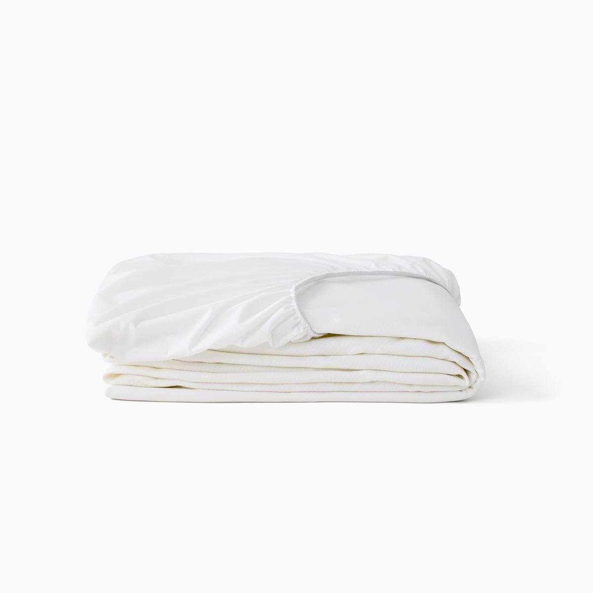 A folded white Beautyrest mattress protector with an elasticized top edge, photographed on a clean white background.