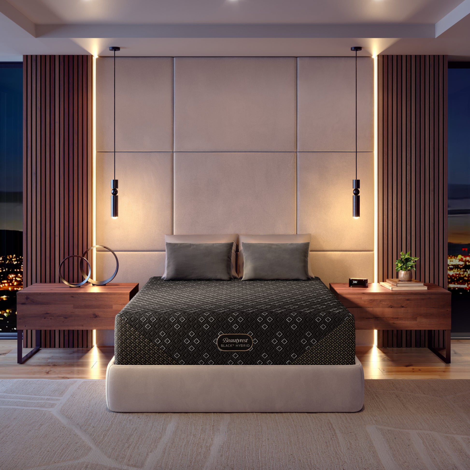Modern bedroom with a cream bed frame featuring a Beautyrest Black Hybid XCS mattress, nightstands, and decorative elements.