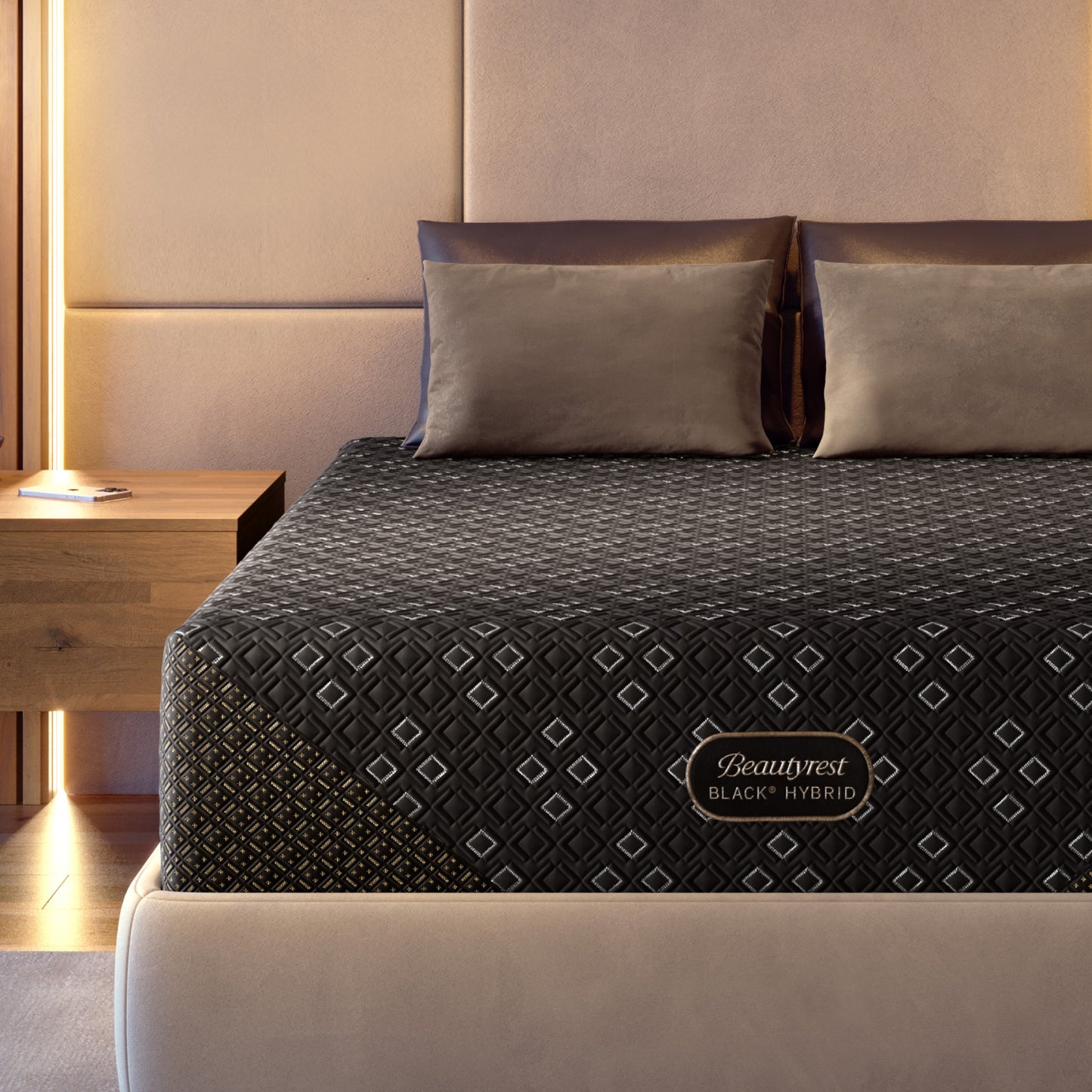 Beautyrest Black Hybid XCS mattress with decorative cover on a bed in a bedroom setting.