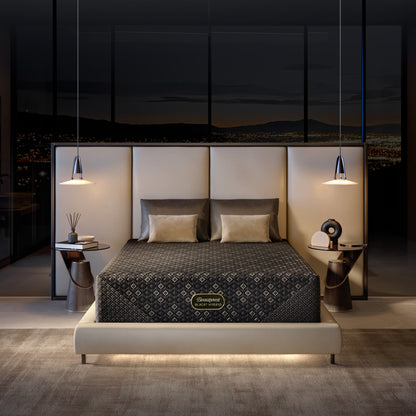 Modern bedroom with a Beautyrest Black Hybid XCS firm mattress in a bed frame featuring a beautyrest mattress brand logo.
