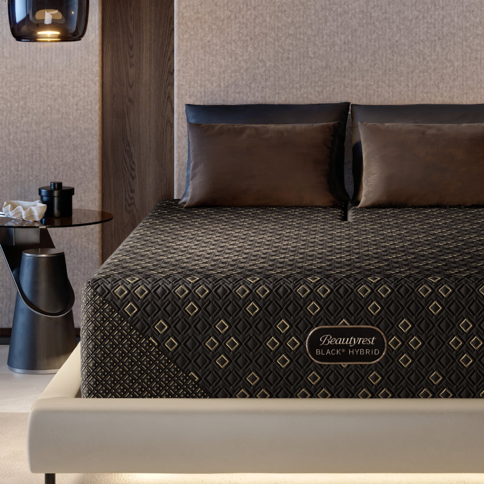 Beautyrest Black Hybid XCS Medium mattress with decorative cover on a bed in a modern bedroom setting.