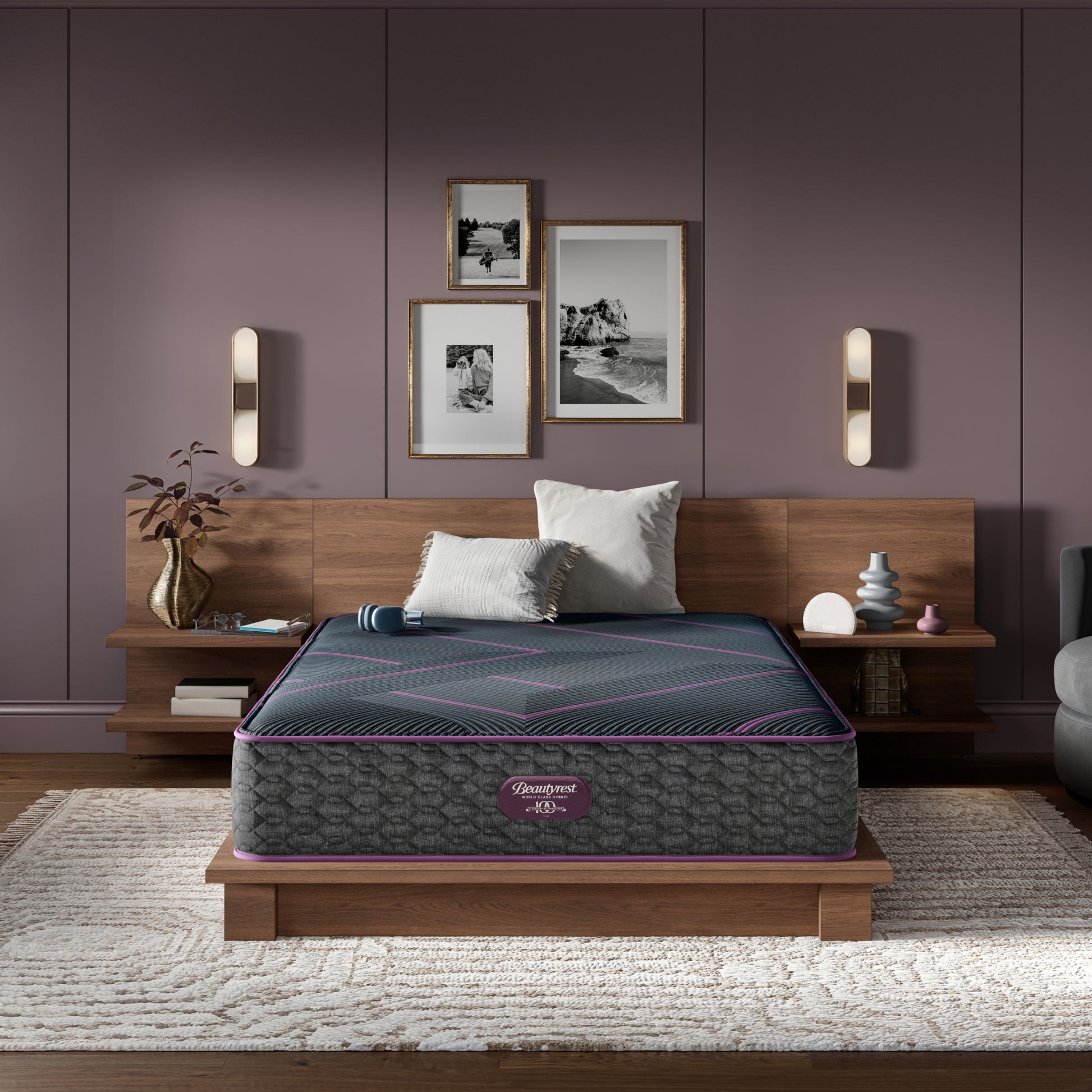 Beautyrest World Class Quilted Hybrid mattress sitting in a brown bed frame with 2 pillows on top of it