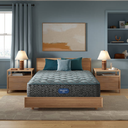 Beautyrest Innerspring Mattress mattress sitting in a brown bed frame with 3 pillows on top of it